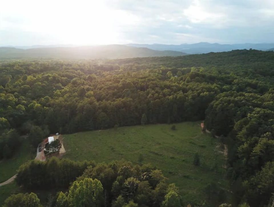 Late evening sun setting overlooking the fruit orchard from the east side.