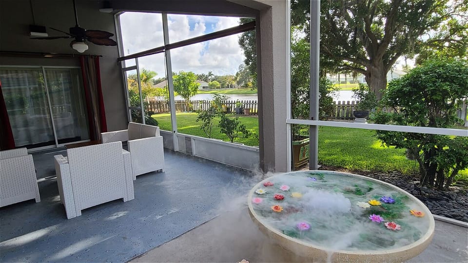 Smoky Fountain on the patio with garden and lake view