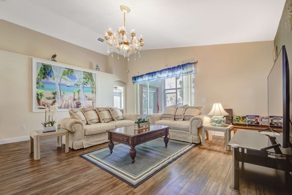 Living Room with 70-in TV and a comfortable Sofa and Love.