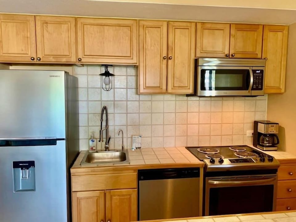 Fridge, Convection Microwave, Range, Dishwasher, and Coffee pot along with purified drinking water.