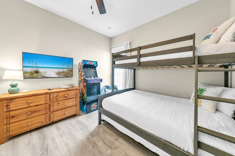 Bunk room with arcade