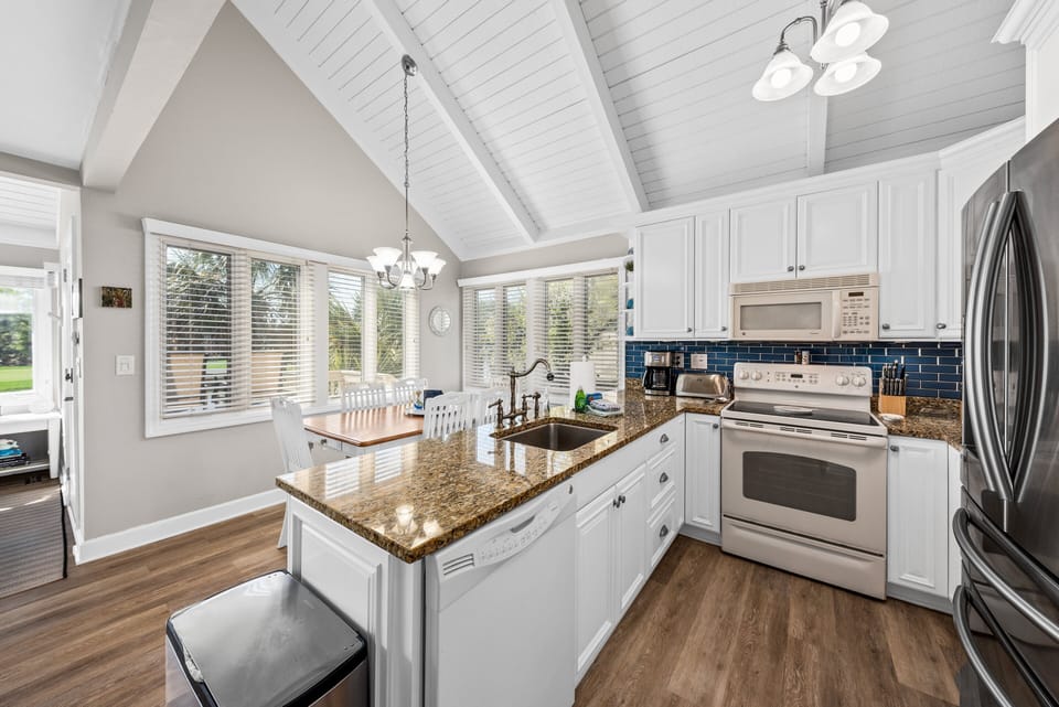 Well equipped,beautiful kitchen with granite counter tops, large Stainless Steel refrigerator and plenty of cabinet storage space.