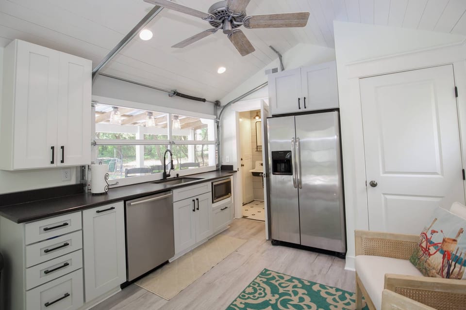Pool House with AC/heat, refrigerator (ice), dishwasher, microwave & television.
