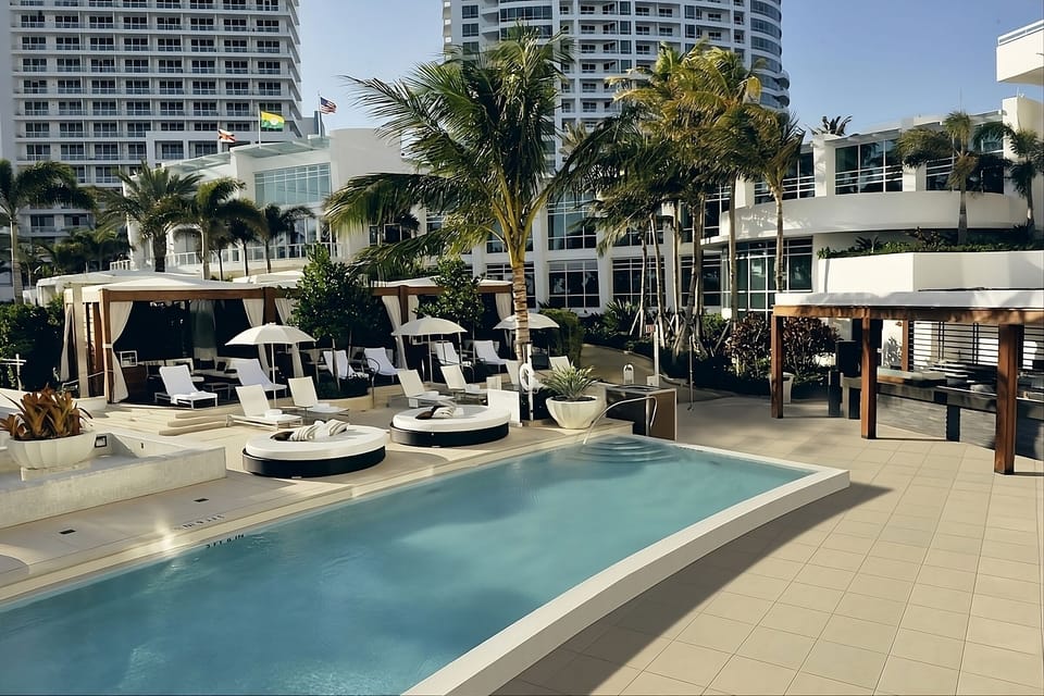 Cool off in the modern pool with stylish lounge decks.