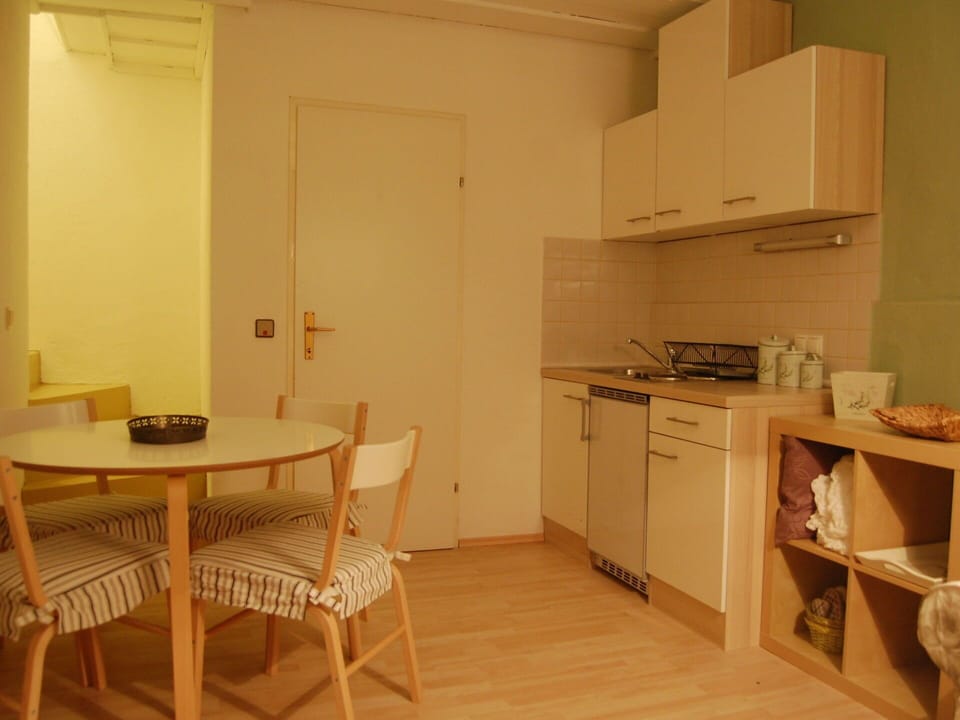 Cabinetry, Furniture, Property, Table, Countertop, Kitchen Appliance, Building, Kitchen Stove, Wood, Chair