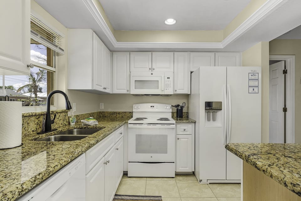 Granite counters and white cabinets