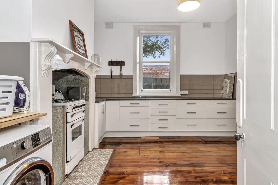 Laundry with a combination washer and dryer.