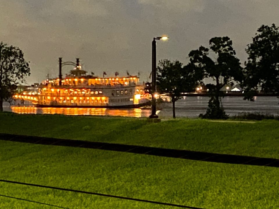 Hear the sounds of the riverboats on the river at night