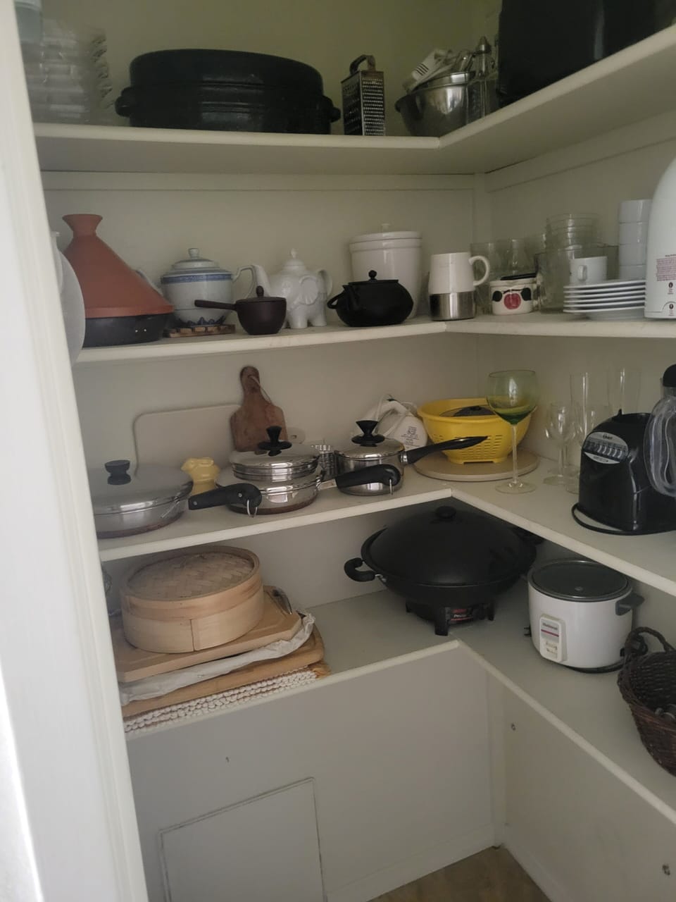 Kitchen pantry behind the first door in hallway.