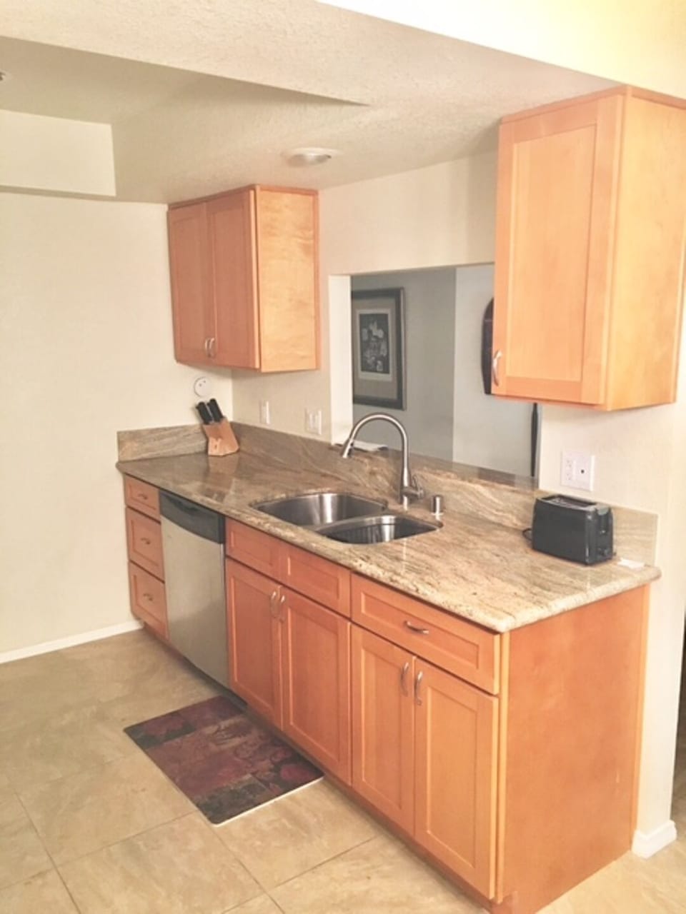 Fully equipped kitchen with pass through to living room.  