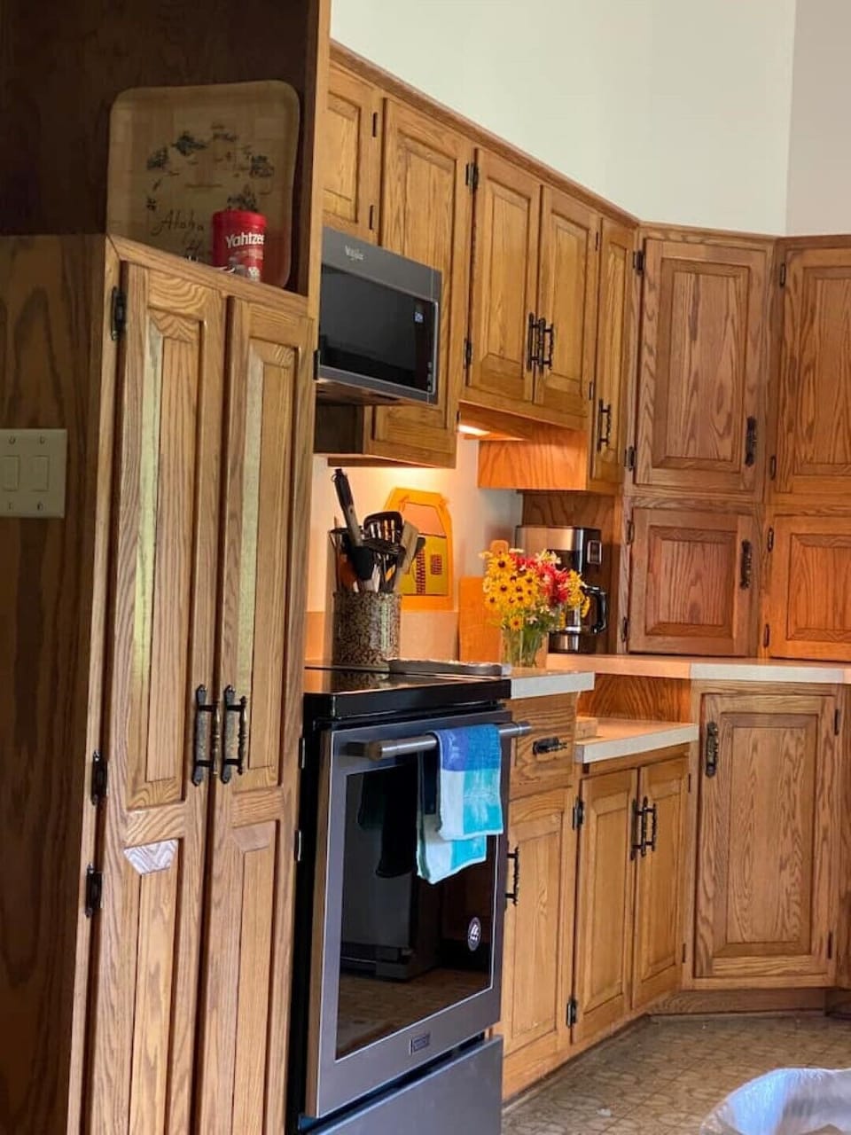 Kitchen looks rustic, but it's well stocked and has great stainless appliances.