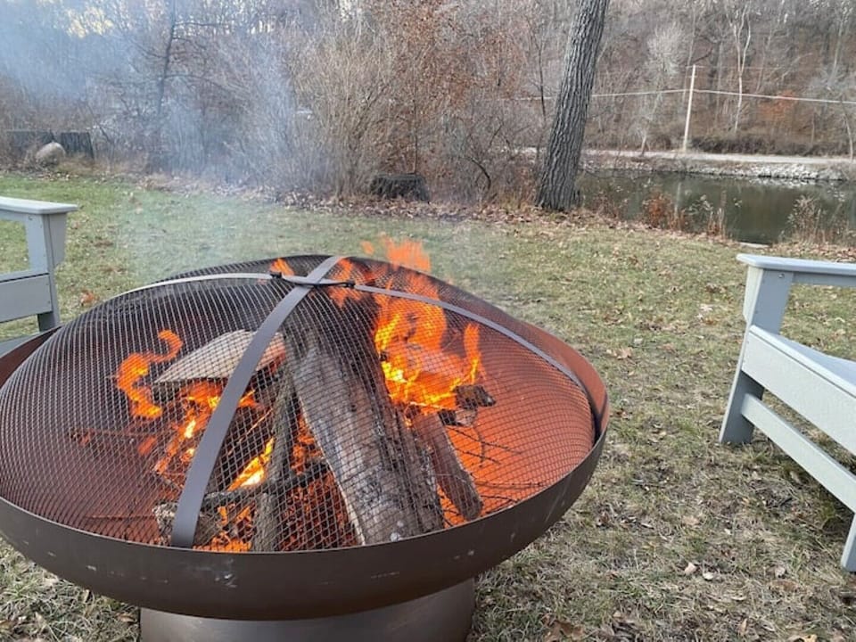 Firepit area includes 4 adirondack chairs.