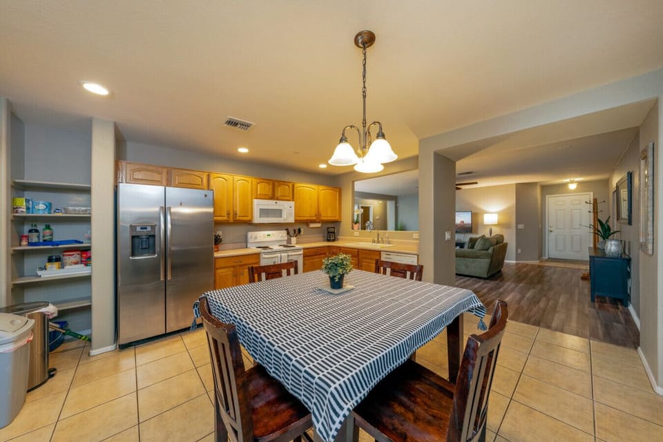 View of the spacious kitchen, dining area, and living room (Please see kitchen photos with updated dining table)