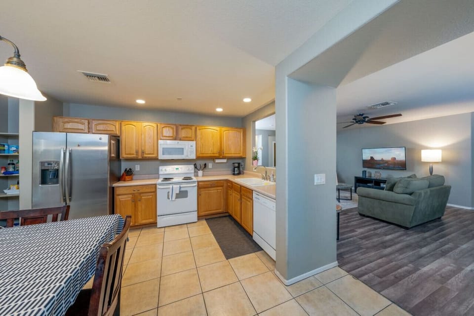 Kitchen and living room space (Please see kitchen photos with updated dining table)