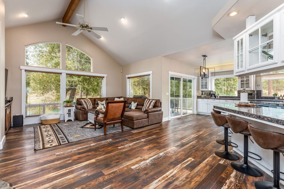 Modern floorplan opens the kitchen to the Family Room with tall vaulted ceilings