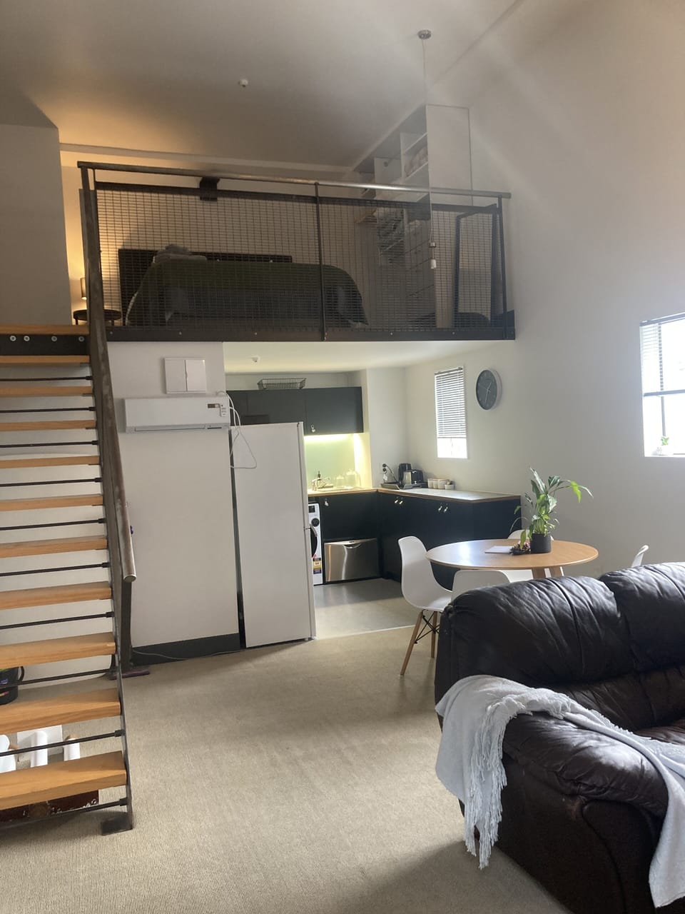View of Mezzanine/loft from ground floor loving area 