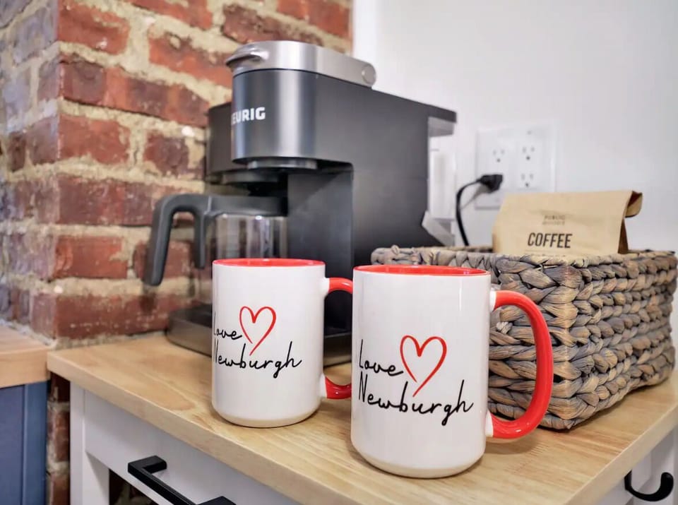 Coffee bar with complimentary coffee, tea, sugar, and creamers