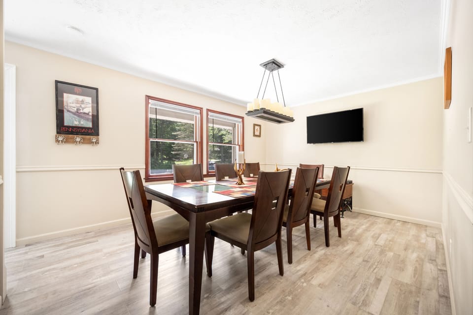 Inviting dining area, perfect for meals, game nights, or a bit of work.
