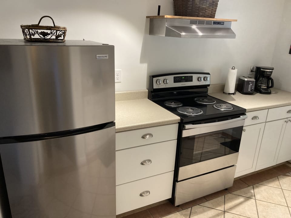Full size stove and refrigerator.