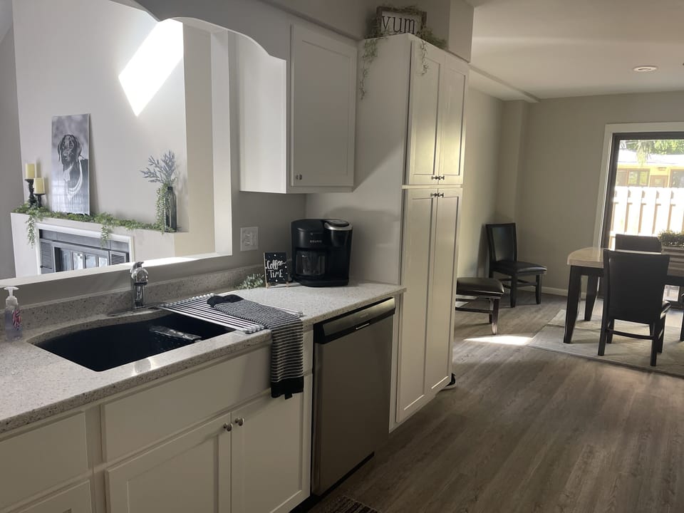 Kitchen with new Dishwasher, disposal, full fridge, stove & microwave