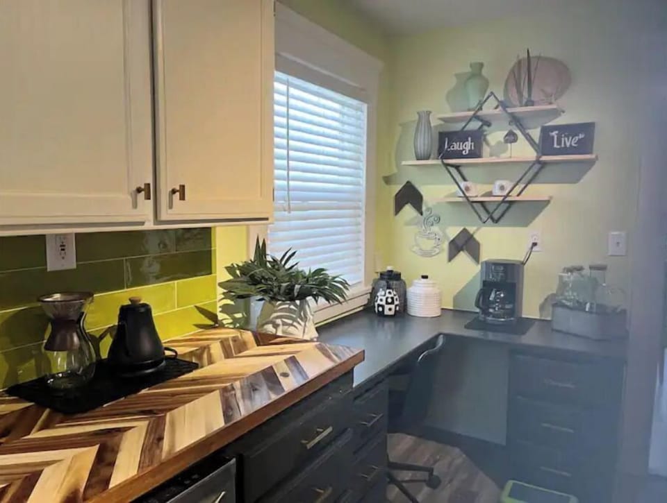 Desk area and fully stocked coffee bar. Drip and pour over pots.