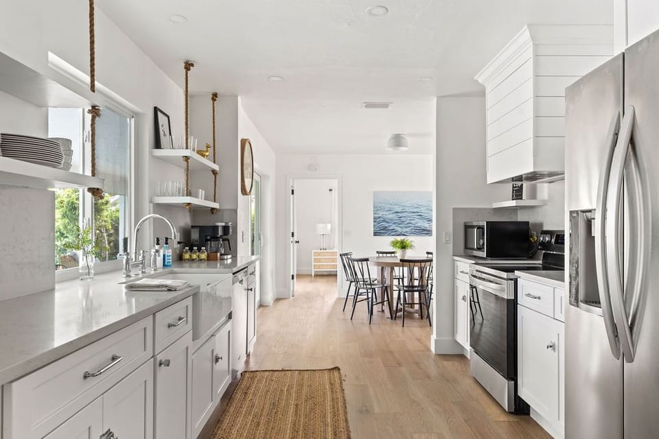Fully renovated kitchen with stainless steel appliances & quartz countertops 