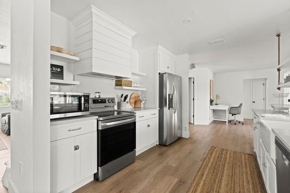 Fully renovated kitchen with stainless steel appliances & quartz countertops 