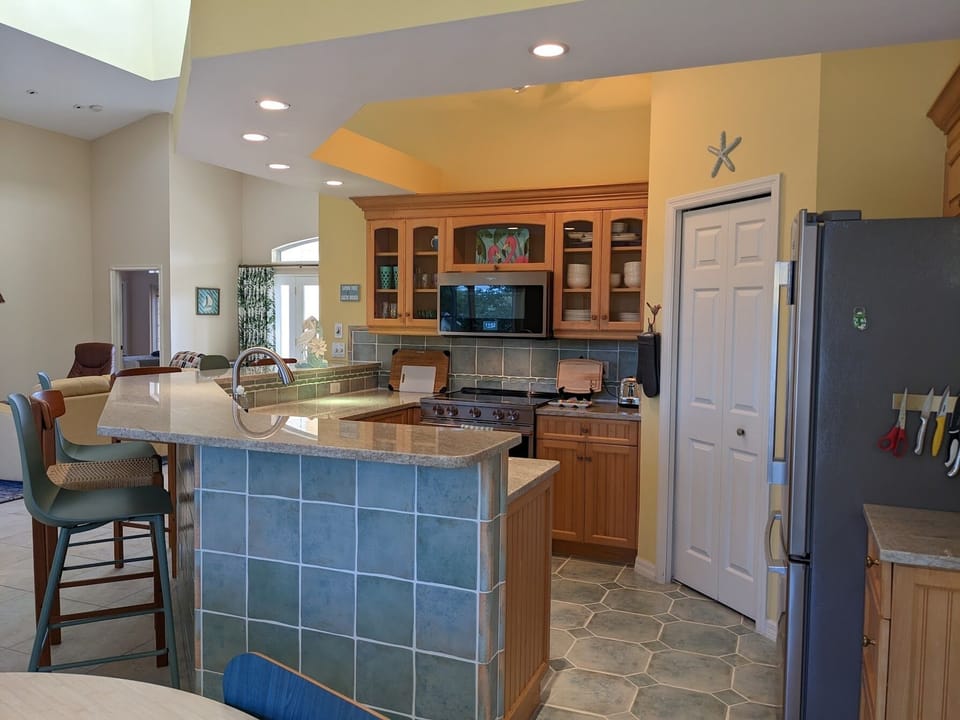 Kitchen area with cupboard area.
