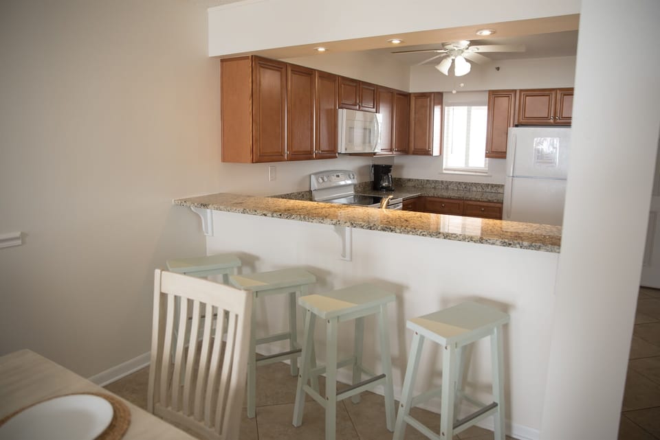 dining area with four barstools