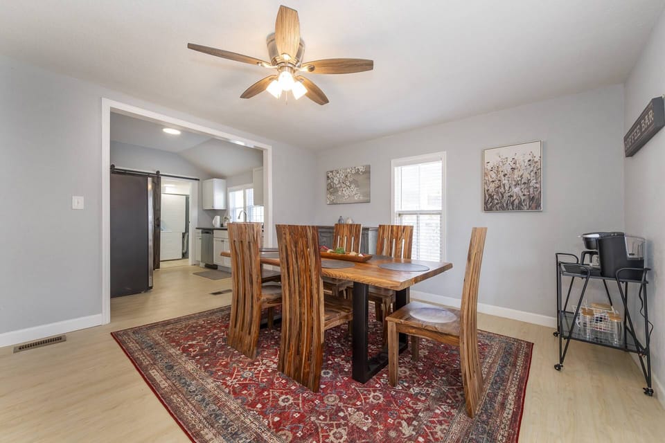 The dining room has a table for 6 and a coffee station with a dual carafe/k-cup coffee pot