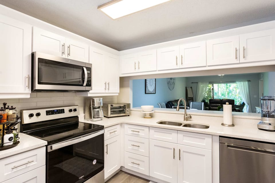 Fully stocked kitchen with new appliances and countertops