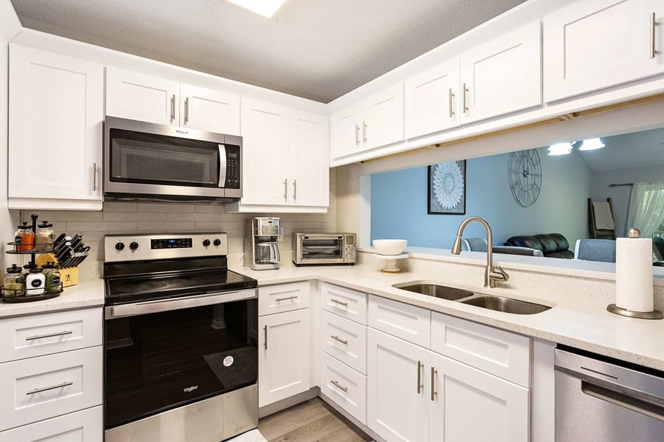 Fully stocked kitchen with new appliances and countertops