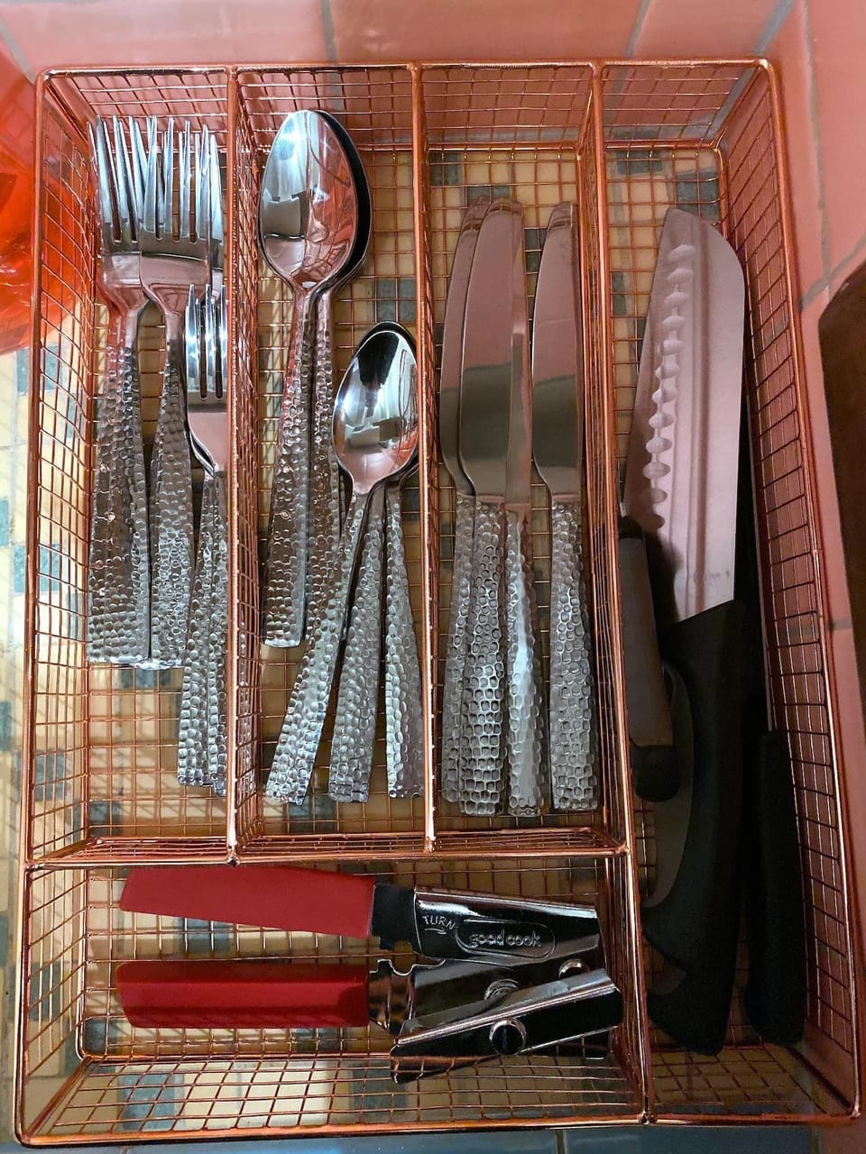 Kitchenette with sink, silverware and dishes...