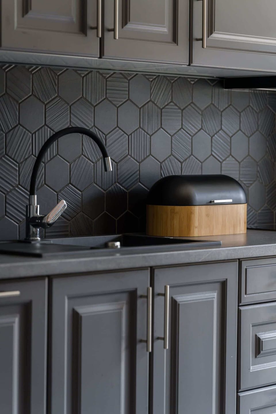 The kitchen's contemporary decor complements the apartment's style.
