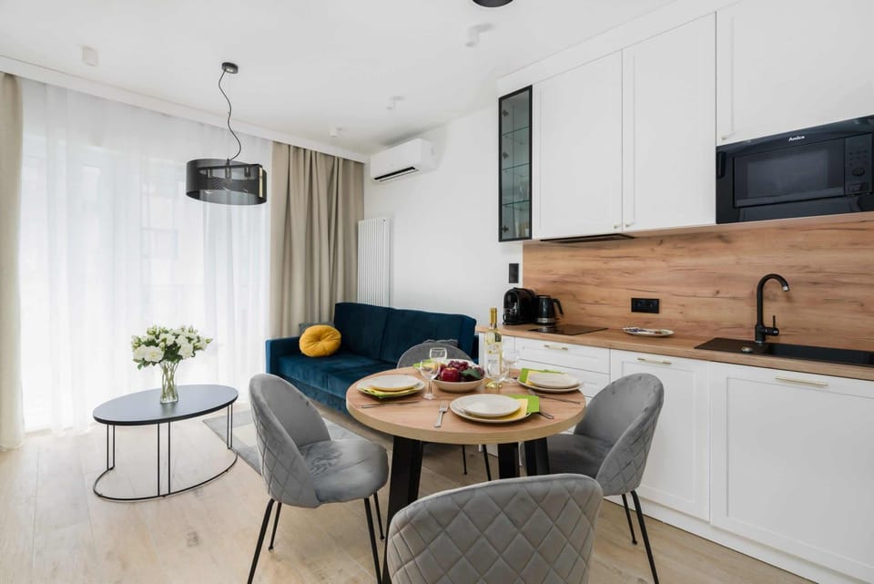 The elegant living room featuring a double sofa bed.