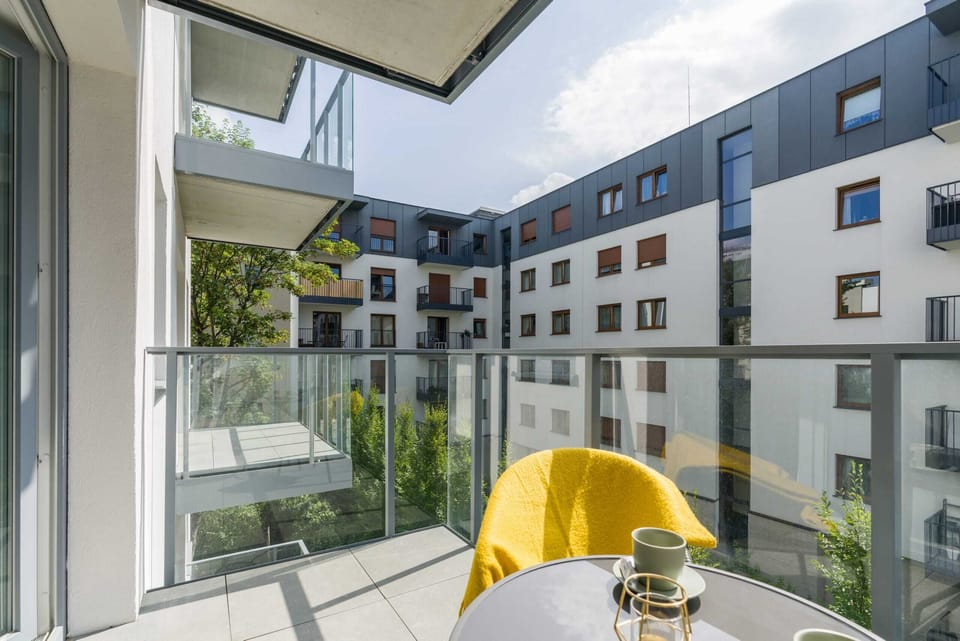 The balcony's stylish design complements the apartment's decor. 