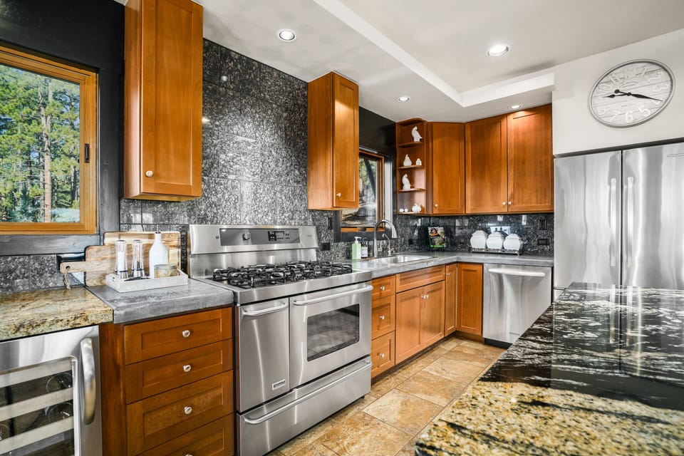 Main House - Kitchen fully stocked with cookware and dishware.