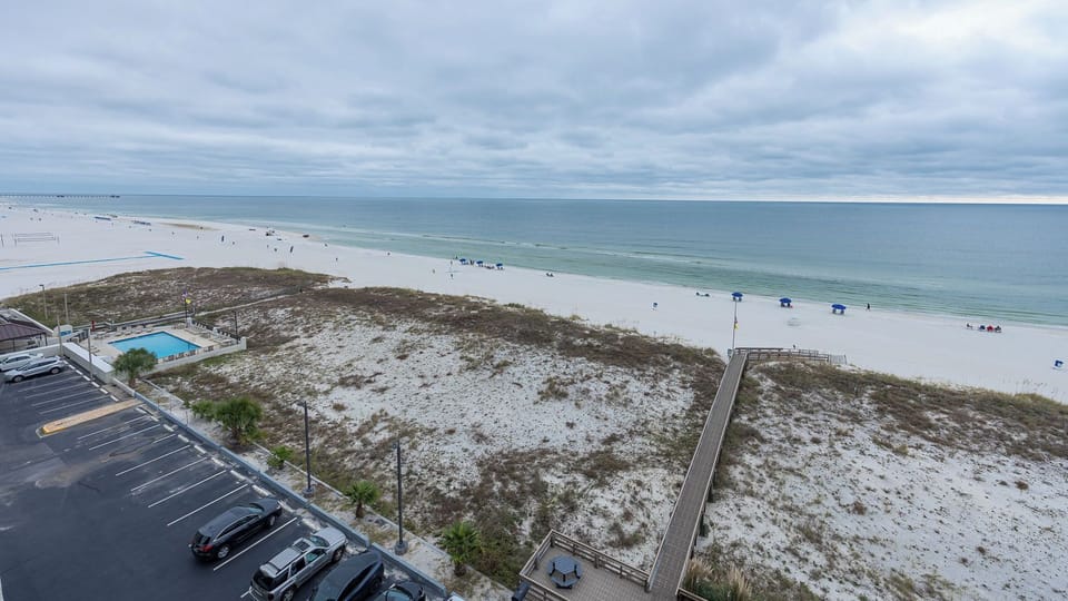 Stunning views of the pristine beach and gentle waves from this inviting coastal retreat