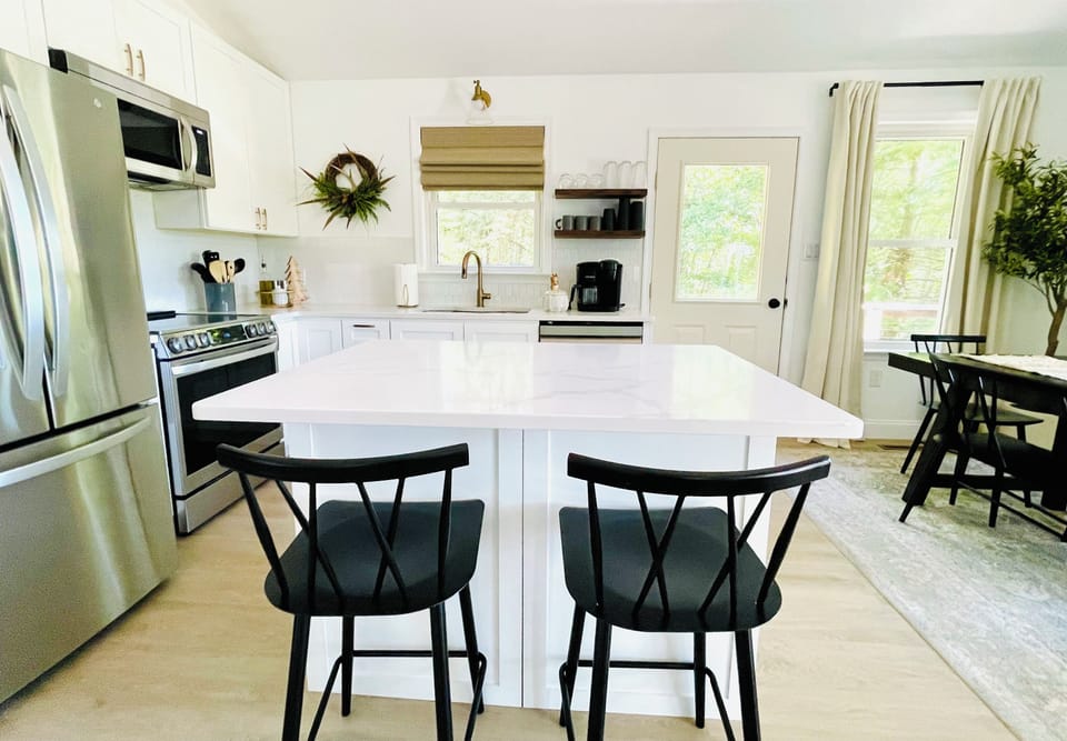 Beautiful, open kitchen area complete with cooking essentials