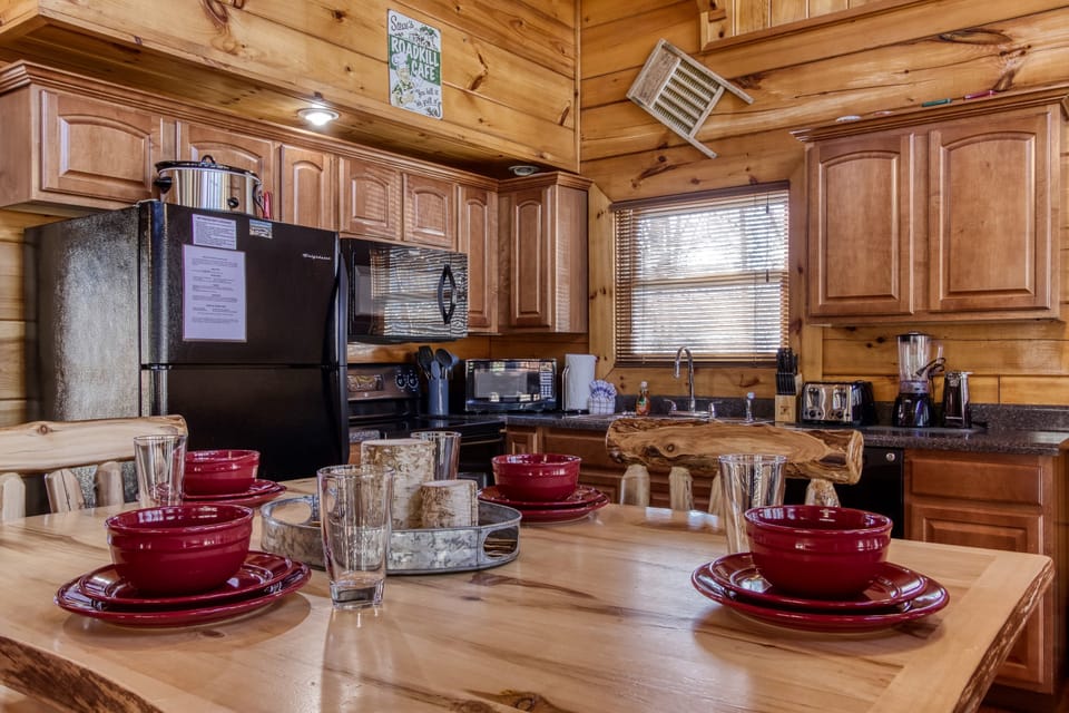 The kitchen is fully stocked with everything you could need to make a family meal. We include full size appliances, dishes and silverware, and even a crockpot!