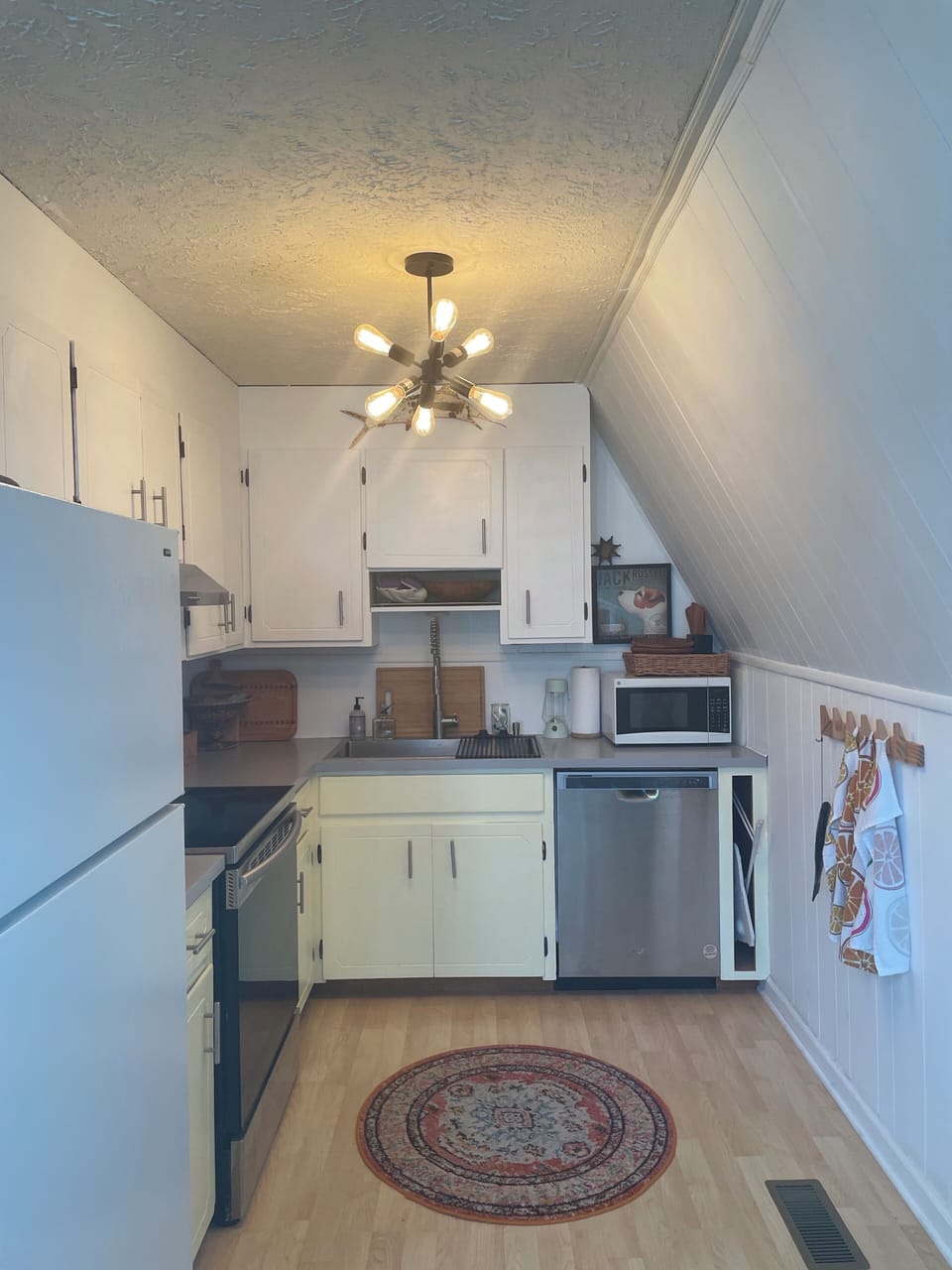 Fully stocked kitchen with dishwasher and microwave. 