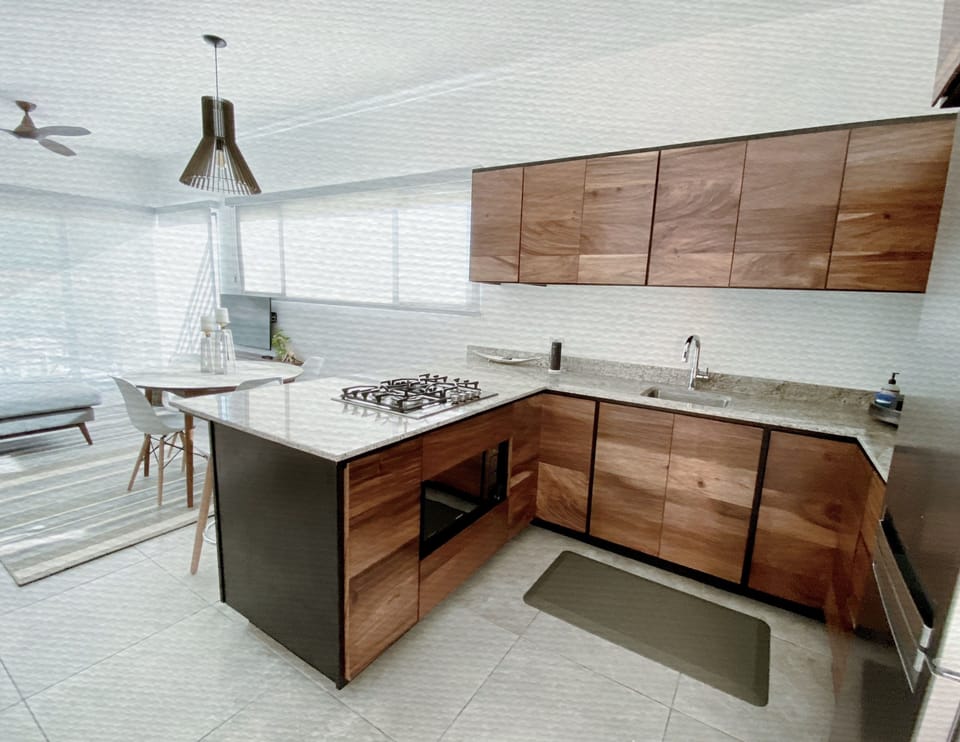 Custom cabinetry in a well-equipped kitchen with a gas stove top.