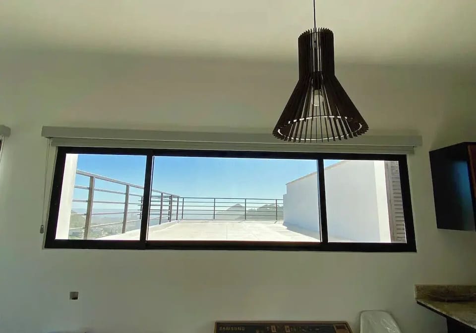 Dining and living areas are light and bright with views to the bay