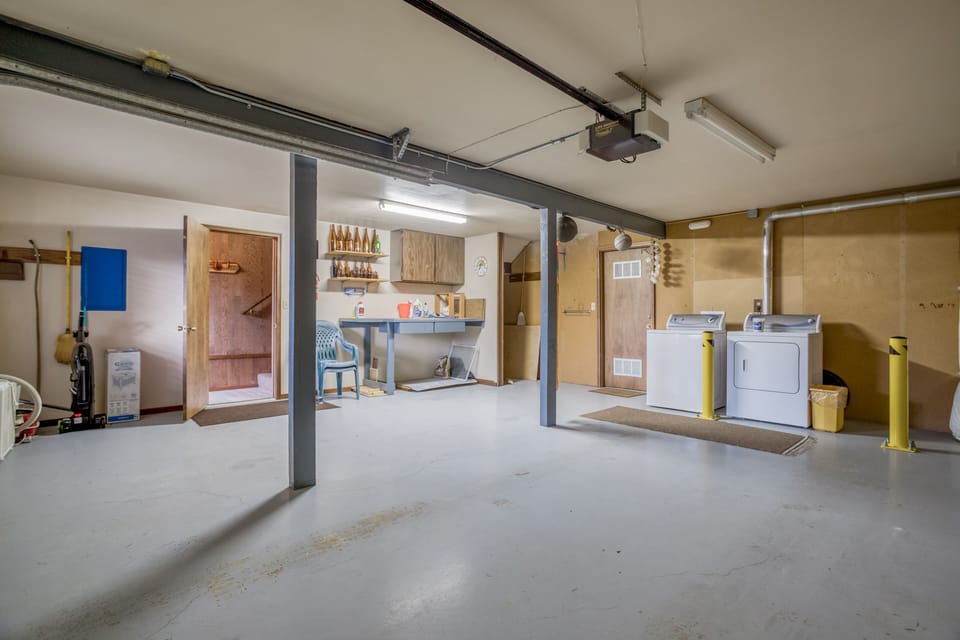 Garage with Laundry space with Washer/ Dryer