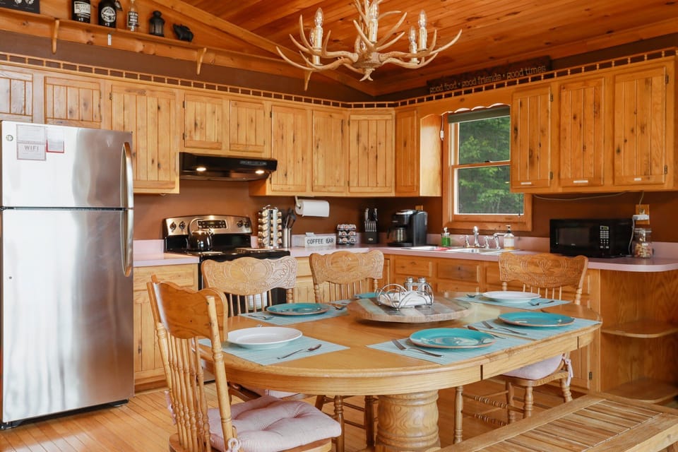 Full kitchen with fridge, oven, microwave, toaster, toaster oven, K-Cup machine