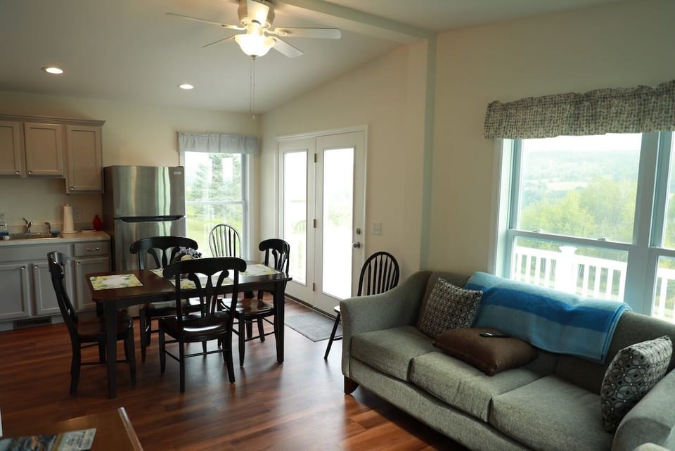 TV/Living Room looking towards eating area and entrance to the deck.