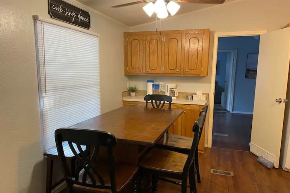 Dining table for 6.  Coffee & tea makers with coffee & tea products available.
