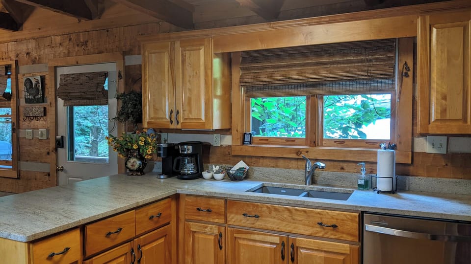 Kitchen counters have new "leathered" granite, July 2023.
