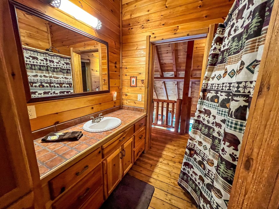 Located in the hallway between the loft area and the private upstairs bedroom.