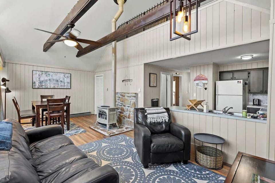 Cozy Corners: Comfy couch, gas stove, Smart TV – perfect for evenings. Soothing mountain view adds to the homely charm.